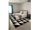 Bright bedroom with a black and white patterned rug, and soothing decor at 609 Spring St, Atlanta, GA 30354