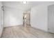 Empty bedroom with wood-look floors, fresh paint, and an ensuite bathroom at 609 Spring St, Atlanta, GA 30354
