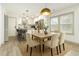 Bright, modern kitchen with dining area, stainless steel appliances and white cabinets at 609 Spring St, Atlanta, GA 30354