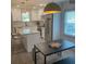 Eat-in kitchen features a large island with granite countertops, stainless appliances, and modern lighting at 609 Spring St, Atlanta, GA 30354