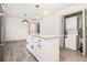 Bright kitchen featuring a granite countertop island with laundry area at 609 Spring St, Atlanta, GA 30354