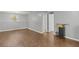 Spacious finished basement area with dark wood flooring and neutral walls at 6332 Fairoaks Pl, Douglasville, GA 30135