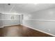 Finished basement area featuring neutral walls, drop ceiling, and dark wood flooring at 6332 Fairoaks Pl, Douglasville, GA 30135