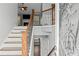 Inviting entryway with staircase, decorative door, and view into the cozy living room beyond at 6332 Fairoaks Pl, Douglasville, GA 30135