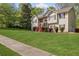 Inviting two-story home with lush green lawn and well-maintained landscaping at 6332 Fairoaks Pl, Douglasville, GA 30135