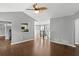Spacious open concept living room with pass through to the kitchen, and stairway to second floor at 6332 Fairoaks Pl, Douglasville, GA 30135