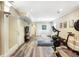 Finished basement features gray wood-look floors, recessed lighting, and fitness equipment at 1257 Arkwright Se Pl, Atlanta, GA 30317