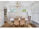 Elegant dining room with chandelier, wainscoting, and large windows at 1257 Arkwright Se Pl, Atlanta, GA 30317