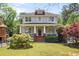 Charming two-story home featuring a welcoming front porch and well-manicured lawn at 1257 Arkwright Se Pl, Atlanta, GA 30317