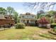 Charming two-story home with manicured lawn, beautiful landscaping, and inviting front porch at 1257 Arkwright Se Pl, Atlanta, GA 30317