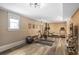 Home gym with workout equipment, including weights, stationary bike, and plenty of room for exercise at 1257 Arkwright Se Pl, Atlanta, GA 30317
