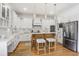 Stylish kitchen featuring a central island, stainless steel appliances, and pristine white cabinets at 1257 Arkwright Se Pl, Atlanta, GA 30317