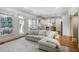 Spacious living room with hardwood floors and adjacent deck overlooking a well-manicured lawn at 1257 Arkwright Se Pl, Atlanta, GA 30317
