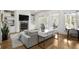 Cozy living room featuring built-in shelving, fireplace, and lots of natural light at 1257 Arkwright Se Pl, Atlanta, GA 30317