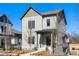 Charming two-story home with gray siding, a welcoming front porch, and a well-manicured lawn at 3322 Springhaven Ave, Hapeville, GA 30354