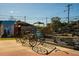 Outdoor seating area featuring unique metal bike art and picnic tables on a sunny day at 3322 Springhaven Ave, Hapeville, GA 30354