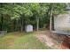 Large backyard with a storage shed and mature trees at 425 Orchard Dr, Stone Mountain, GA 30083