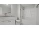 Bathroom featuring a tub and shower combo, modern vanity, and bright lighting at 425 Orchard Dr, Stone Mountain, GA 30083