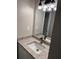 Bathroom with granite vanity top, modern faucet, and updated lighting at 425 Orchard Dr, Stone Mountain, GA 30083