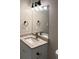 Bathroom featuring granite vanity and modern fixtures, including a decorative light fixture at 425 Orchard Dr, Stone Mountain, GA 30083