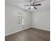 Well-lit bedroom with a ceiling fan, neutral walls, and a window for natural light at 425 Orchard Dr, Stone Mountain, GA 30083