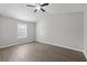 Bedroom featuring a ceiling fan, vaulted ceilings, neutral walls, and a window at 425 Orchard Dr, Stone Mountain, GA 30083