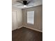 Bedroom featuring hardwood floors, a ceiling fan with light, and a closet at 425 Orchard Dr, Stone Mountain, GA 30083