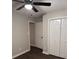 Bedroom features dark floors and standard bi-fold closet doors at 425 Orchard Dr, Stone Mountain, GA 30083