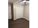 Bedroom features dark flooring and a standard white bi-fold closet door at 425 Orchard Dr, Stone Mountain, GA 30083