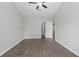 Spacious bedroom with a ceiling fan, neutral walls, and an ensuite bathroom at 425 Orchard Dr, Stone Mountain, GA 30083