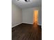 Bedroom features a ceiling fan, a window, and hardwood floors at 425 Orchard Dr, Stone Mountain, GA 30083