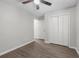 Spacious bedroom featuring a ceiling fan, neutral walls, and a large closet at 425 Orchard Dr, Stone Mountain, GA 30083
