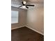 Bright bedroom with window, fan, and modern flooring at 425 Orchard Dr, Stone Mountain, GA 30083