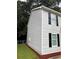 Corner view of the exterior showcasing the siding and black shutters at 425 Orchard Dr, Stone Mountain, GA 30083