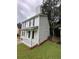 Charming two-story home with landscaped yard at 425 Orchard Dr, Stone Mountain, GA 30083