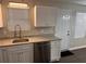 The kitchen features granite countertops, stainless steel appliances, and white cabinetry at 425 Orchard Dr, Stone Mountain, GA 30083