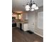 Well-lit kitchen features stainless steel appliances, white cabinetry, and stylish light fixture at 425 Orchard Dr, Stone Mountain, GA 30083