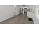 Open kitchen and dining area with stainless steel appliances, granite countertops, and modern lighting at 425 Orchard Dr, Stone Mountain, GA 30083