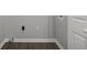 Bright laundry room featuring durable wood-look flooring and crisp white trim at 425 Orchard Dr, Stone Mountain, GA 30083