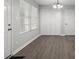 Inviting living room with hardwood floors, a closet, and plenty of natural light from the windows at 425 Orchard Dr, Stone Mountain, GA 30083