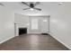 Cozy living room with a fireplace, a ceiling fan, hardwood floors and plenty of natural light at 425 Orchard Dr, Stone Mountain, GA 30083