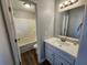 A bathroom featuring a vanity with a white countertop and mirror, with bathtub and toilet at 118 Dove Lndg, Social Circle, GA 30025