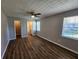 Serene bedroom with neutral walls, natural light, and modern wood-look floors, leading to an ensuite bathroom at 118 Dove Lndg, Social Circle, GA 30025