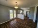 Open-concept kitchen with modern stainless steel appliances and a convenient breakfast bar, ideal for entertaining at 118 Dove Lndg, Social Circle, GA 30025