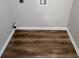 Practical laundry area with new wood-look floors and essential hookups, adding convenience to daily routines at 118 Dove Lndg, Social Circle, GA 30025