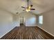 Spacious living room with vaulted ceilings, modern ceiling fan, and stylish wood-look floors for a modern feel at 118 Dove Lndg, Social Circle, GA 30025