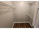 Organized walk-in closet with adjustable shelving, providing ample storage and easy accessibility for wardrobe at 118 Dove Lndg, Social Circle, GA 30025