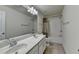 This bathroom has dual sinks, and a shower and tub combination with a shower curtain at 13030 Dartmore Ave, Alpharetta, GA 30005