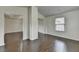 Open-concept room with hardwood flooring and an airy, open feel at 13030 Dartmore Ave, Alpharetta, GA 30005
