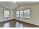 Well-lit bedroom with a vaulted ceiling and multiple windows at 13030 Dartmore Ave, Alpharetta, GA 30005
